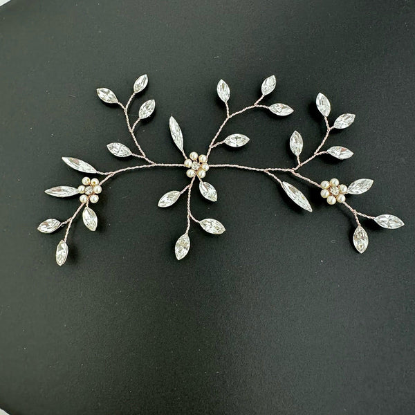 Austrian crystal hairpiece 5 inches wide by 3 inches high. Small pearl flowers with tiny crystal centers.